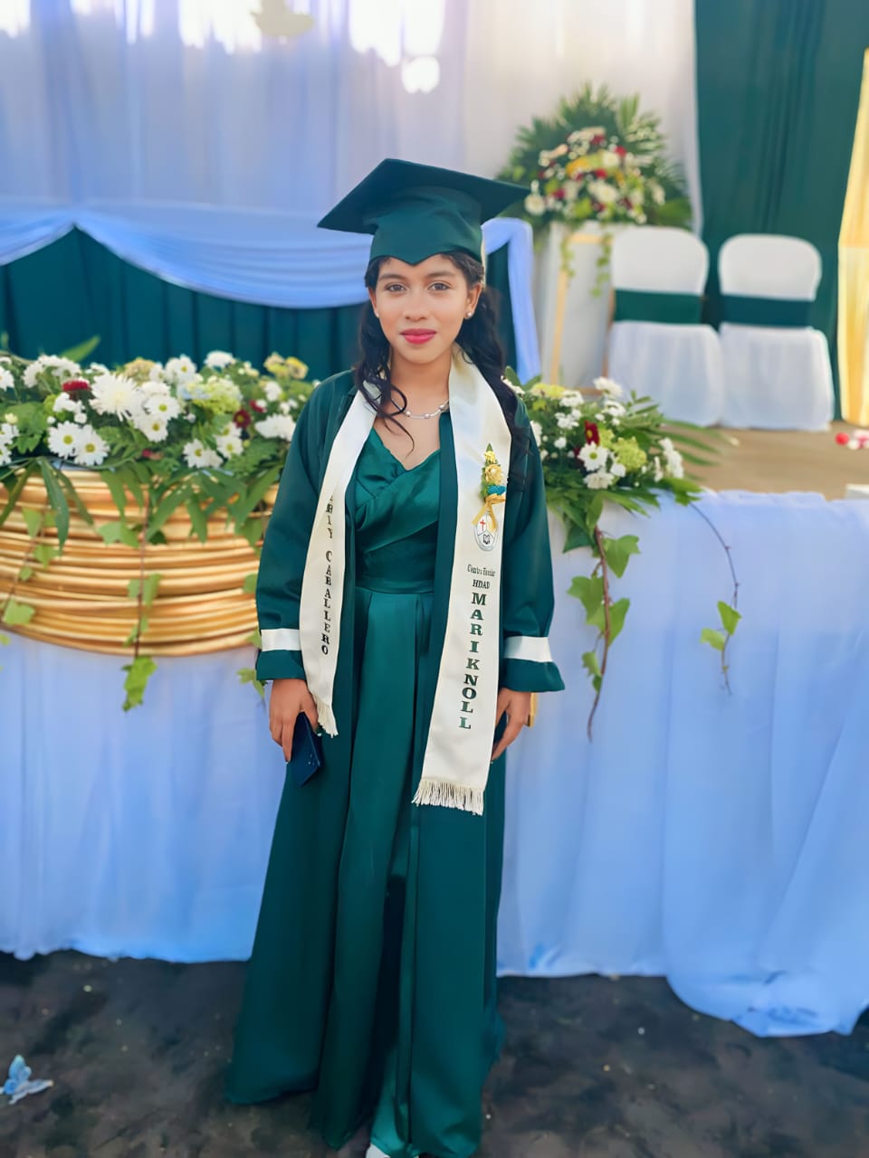 Scholarship graduate in cap and gown